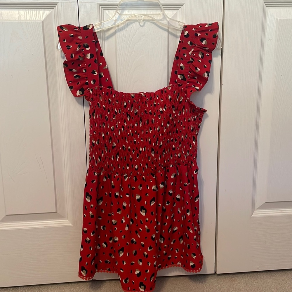 Red boutique babydoll top with leopard print. Size large